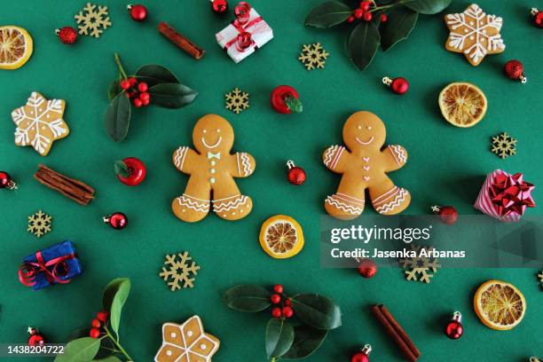 christmas pattern made with various winter and christmas objects on green  background. - zagreb food stock pictures, royalty-free photos & images