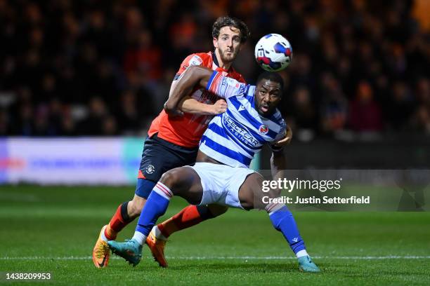 Tom Lockyer of Luton Town challenges Yakou Meite of Reading during the Sky Bet Championship between Luton Town and Reading at Kenilworth Road on...