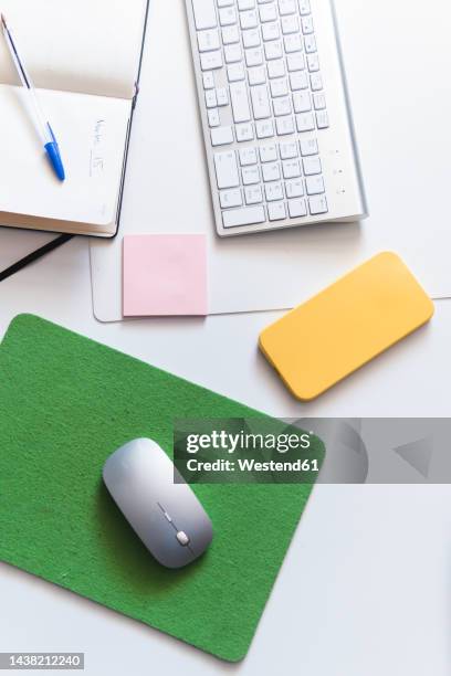 wireless technologies with diary on desk at office - mouse pad stock pictures, royalty-free photos & images