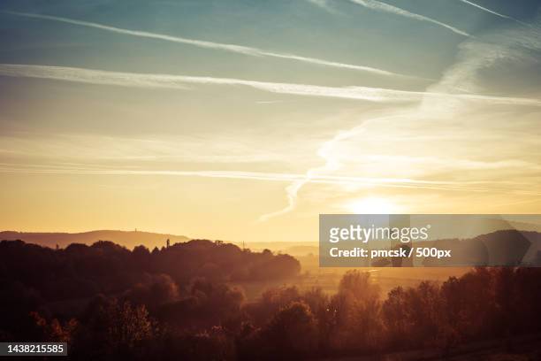 scenic view of silhouette of landscape against sky during sunset,aachen,germany - aachen fotografías e imágenes de stock