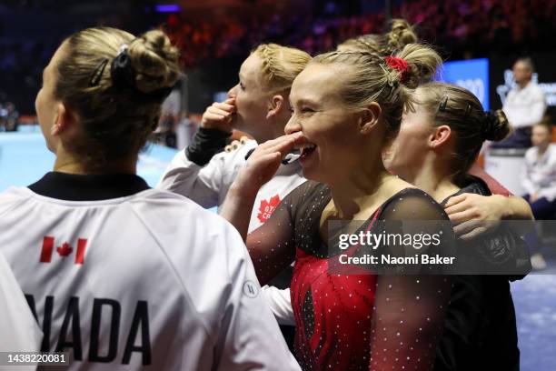 Team Canada celebrate their third place following the Women's Team Final on day four of the 2022 Gymnastics World Championships at M&S Bank Arena on...