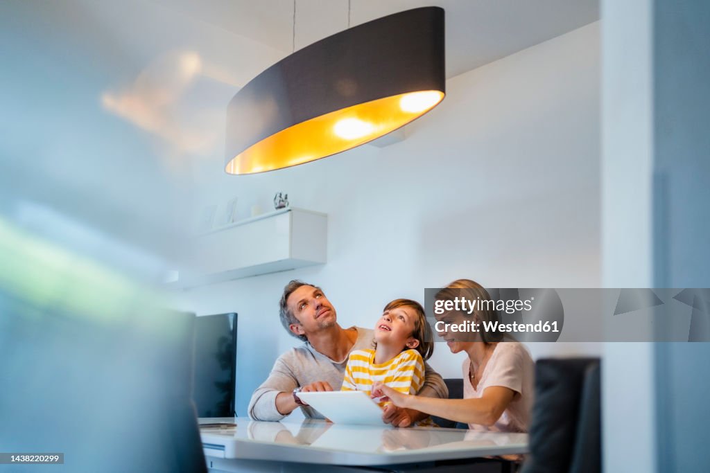 Family controlling ceiling lamp with tablet PC in Smart Home
