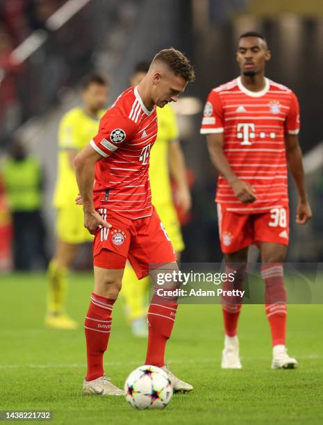 Joshua Kimmich of Bayern Munich reacts after fouling Davide Marfella of Napoli during the UEFA Champions League group C match between FC Bayern...