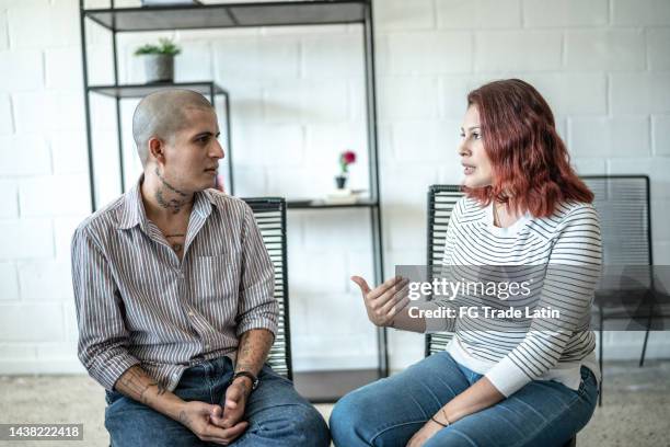 people talking during a psychotherapy or group therapy - aa meeting stock pictures, royalty-free photos & images