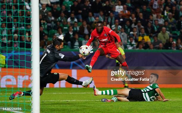 Randal Kolo Muani of Eintracht Frankfurt scores their side's second goal as Antonio Adan of Sporting CP attempts to make a save during the UEFA...