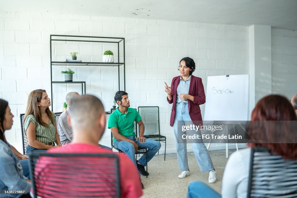 Mid adult woman doing a presentation during meeting