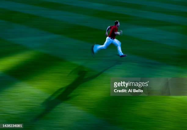 Chris Devenski of the Philadelphia Phillies runs in the outfield during batting practice before the start of Game Three of the 2022 World Series...
