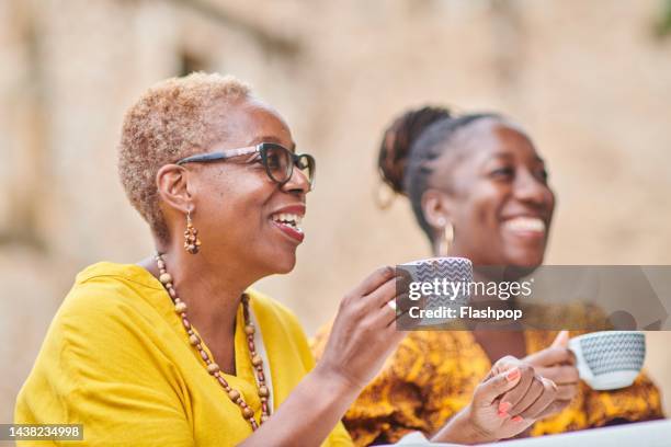 a small group of women in conversation - town meeting stock pictures, royalty-free photos & images