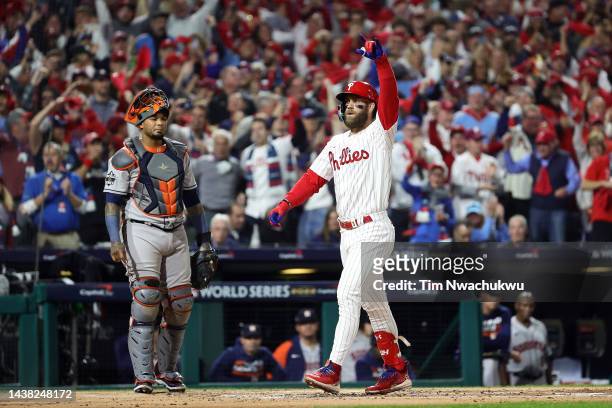Bryce Harper of the Philadelphia Phillies reacts after hitting a home run against the Houston Astros during the first inning in Game Three of the...