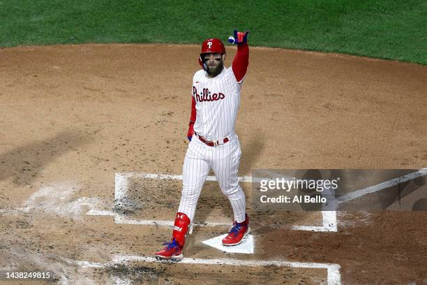 Bryce Harper of the Philadelphia Phillies celebrates after hitting a two-run home run against the Houston Astros during the first inning in Game...