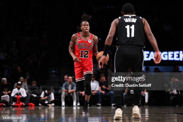 Ayo Dosunmu of the Chicago Bulls brings the ball up the court during the first quarter of the game against the Brooklyn Nets at Barclays Center on...