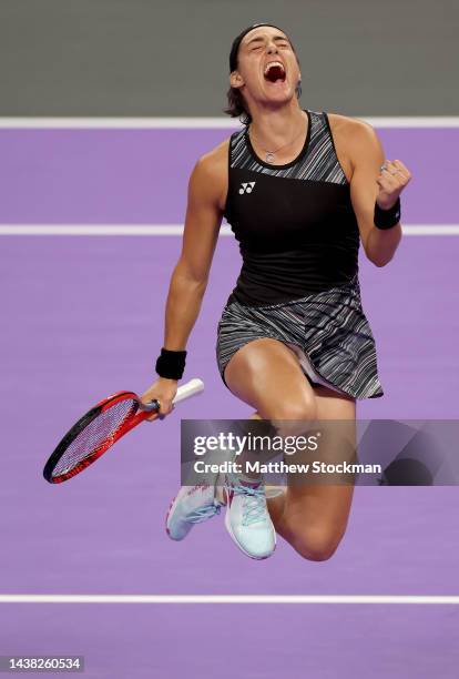 Caroline Garcia of France celebrates after defeating Coco Gauff of the United States in their Women's Singles Group Stage match during the 2022 WTA...