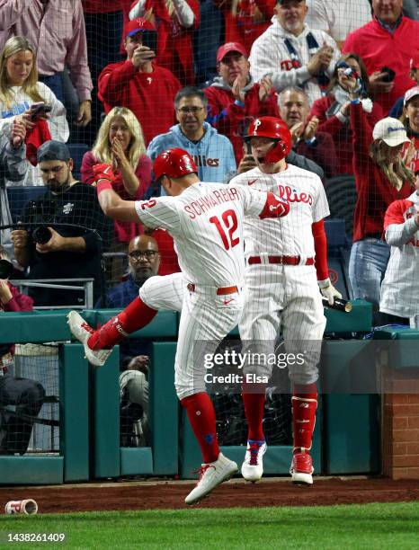 Kyle Schwarber of the Philadelphia Phillies celebrates his home run with teammate Rhys Hoskins during the fifth inning against the Houston Astros in...