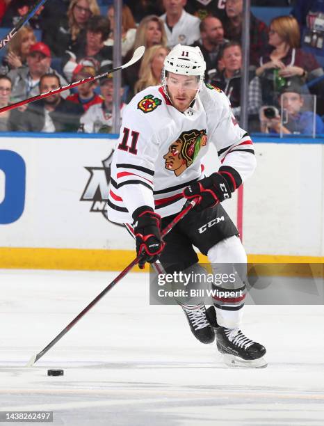 Taylor Raddysh of the Chicago Blackhawks skates with the puck against the Buffalo Sabres during an NHL game on October 29, 2022 at KeyBank Center in...