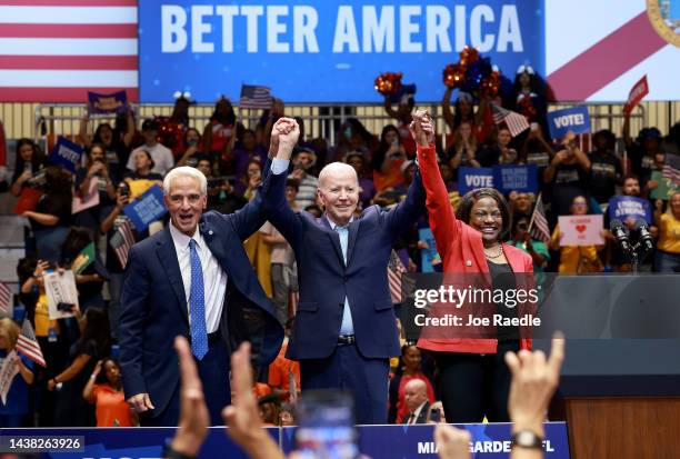 President Joe Biden stands with Democratic U.S. Senate candidate, Rep. Val Demings and gubernatorial candidate Charlie Crist during a rally at...