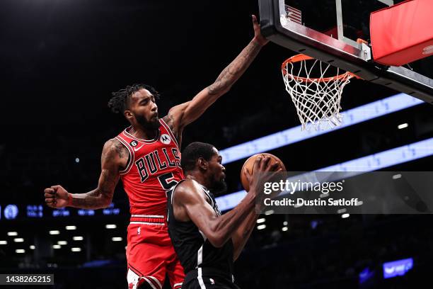 Kevin Durant of the Brooklyn Nets attempts a shot against by Derrick Jones Jr. #5 of the Chicago Bulls during the third quarter of the game at...