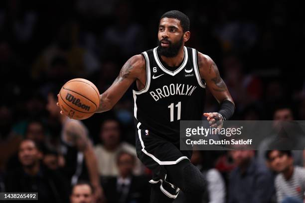 Kyrie Irving of the Brooklyn Nets brings the ball up the court during the fourth quarter of the game against the Chicago Bulls at Barclays Center on...