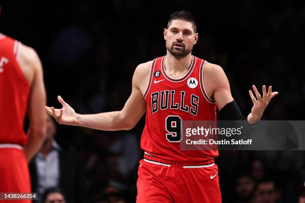 Nikola Vucevic of the Chicago Bulls gestures to a teammate after committing a foul during the fourth quarter of the game against the Brooklyn Nets at...