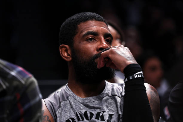 Kyrie Irving of the Brooklyn Nets looks on from the bench during the second quarter of the game against the Chicago Bulls at Barclays Center on...
