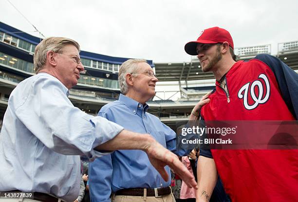 From left, columnist and baseball fan George Will, Senate Majority Leader Harry Reid, D-Nev., and Washington Nationals outfielder Bryce Harper, a...