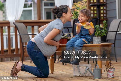 Mom and daughter having fun outside on patio