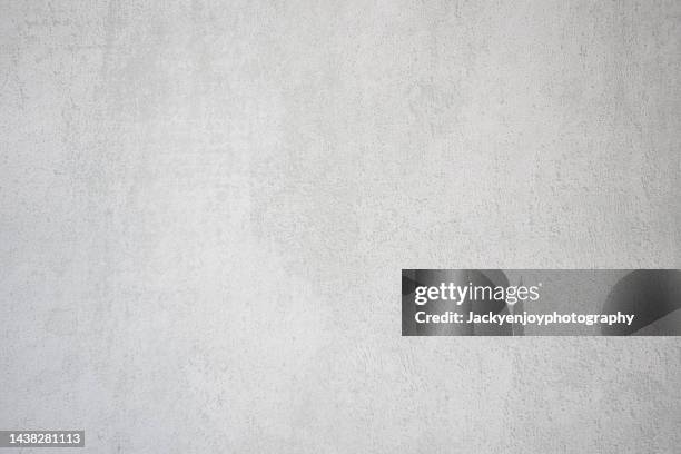 closeup of a white concrete wall - flat stone texture stock pictures, royalty-free photos & images