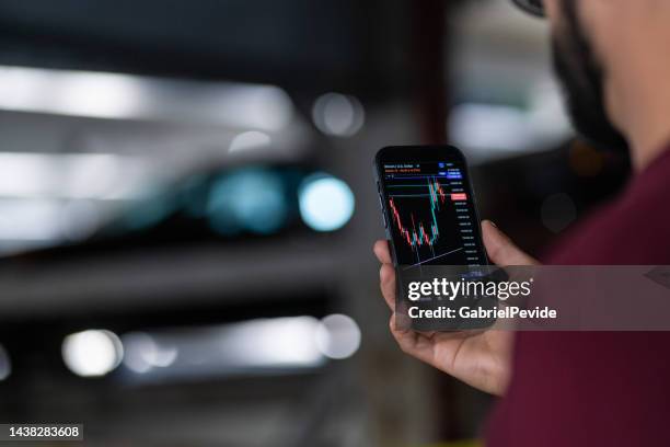 young of the new generation investing in bitcoin - token stock pictures, royalty-free photos & images