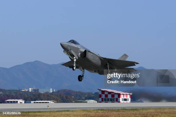 In this handout image released by the South Korean Defense Ministry, a South Korean Air Force F-35A fighter jet takes off from the runway during the...