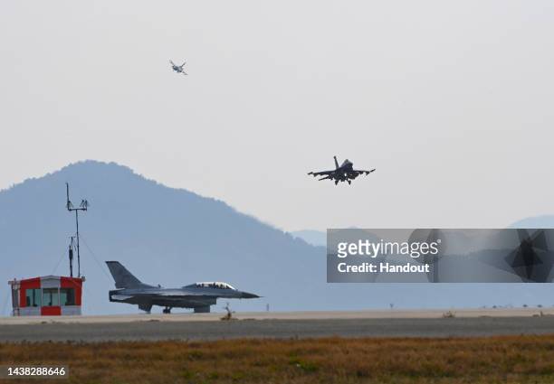 In this handout image released by the South Korean Defense Ministry, South Korean Air Force KF-16 fighter jet and US Air Force F-16 fighter jets are...