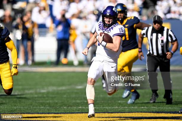 Max Duggan of the TCU Horned Frogs rushes the ball against the West Virginia Mountaineers at Mountaineer Field on October 29, 2022 in Morgantown,...