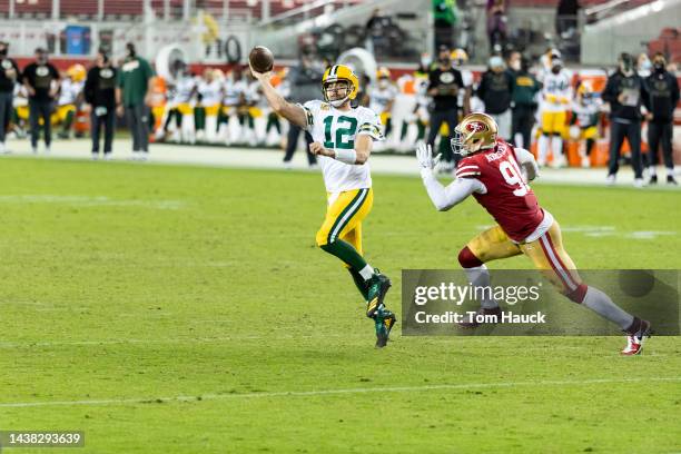 Green Bay Packers quarterback Aaron Rodgers rolls out to pass and is sacked by San Francisco 49ers offensive tackle Jordan Willis during an NFL...