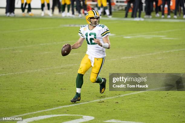 Green Bay Packers quarterback Aaron Rodgers rolls out to pass and is sacked by San Francisco 49ers offensive tackle Jordan Willis during an NFL...