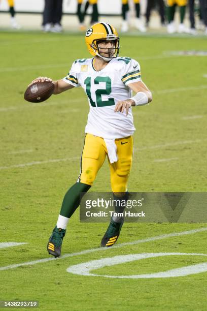 Green Bay Packers quarterback Aaron Rodgers rolls out to pass and is sacked by San Francisco 49ers offensive tackle Jordan Willis during an NFL...