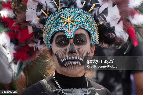 Young girl dressed in a 'Day of the Dead' costume poses for a photo on November 01, 2022 in Tepito, Mexico. People from across the city go to Tepito,...