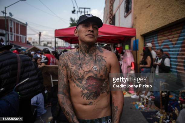 Gang member shows off his tattoos of Santa Muerte on November 01, 2022 in Tepito, Mexico. People from across the city go to Tepito, the most...