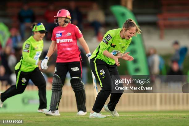 Sam Bates of Thunder celebrates the wicket of Ellyse Perry of the Sixers during the Women's Big Bash League match between the Sydney Thunder and the...