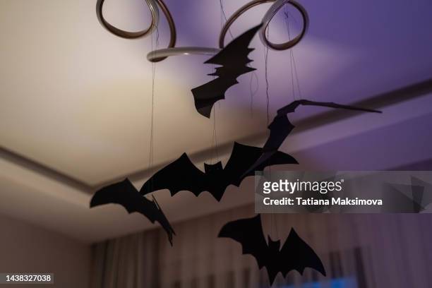 halloween decoration at home. bat from paper. - halloween craft stock pictures, royalty-free photos & images