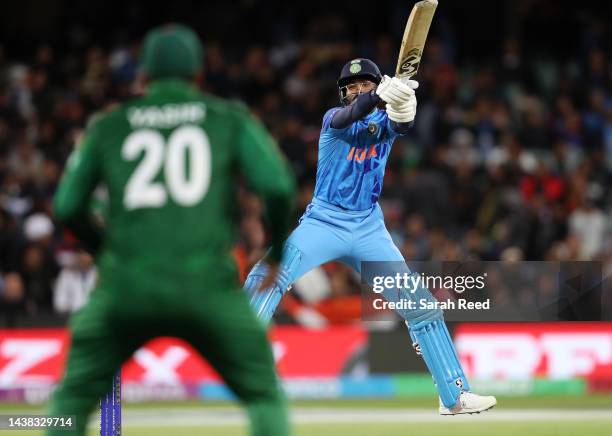 Hardik Pandya of India hits the ball straight to Yasir Ali Chowdhury of Bangladesh out for 5 runs during the ICC Men's T20 World Cup match between...