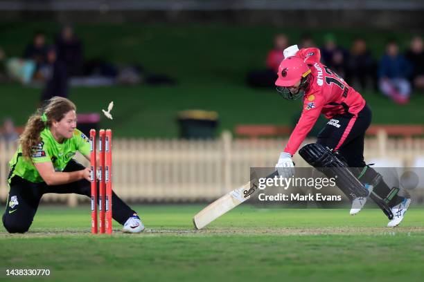 Nicole Bolton of the Sixers is run out by Belinda Vakarewa of Thunder during the Women's Big Bash League match between the Sydney Thunder and the...