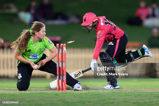 Nicole Bolton of the Sixers is run out by Belinda Vakarewa of Thunder during the Women's Big Bash League match between the Sydney Thunder and the...