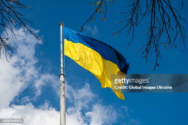 Ukrainian national flag flutters in wind on a flagpole near the Lviv Regional State Administration on October 27, 2022 in Lviv, Ukraine.