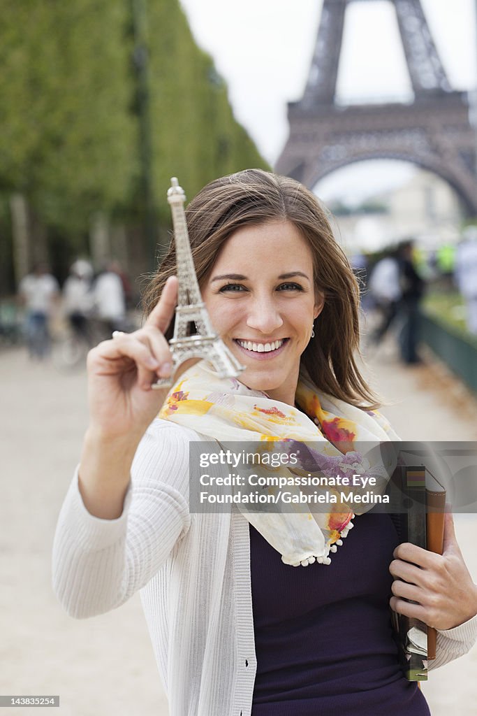 Student holding souvenir Eiffel Tower