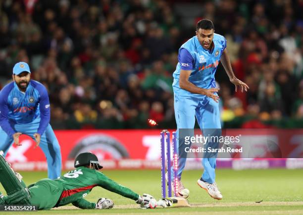 Ravichandran Ashwin of India watches Litton Das of Bangladesh run out by KL Rahul of India for 60 runsduring the ICC Men's T20 World Cup match...