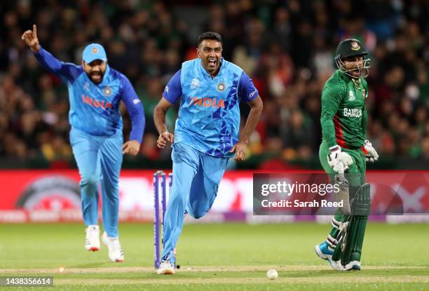 Ravichandran Ashwin of India runs towards KL Rahul of India after he ran out of Litton Das of Bangladesh for 60 runs during the ICC Men's T20 World...