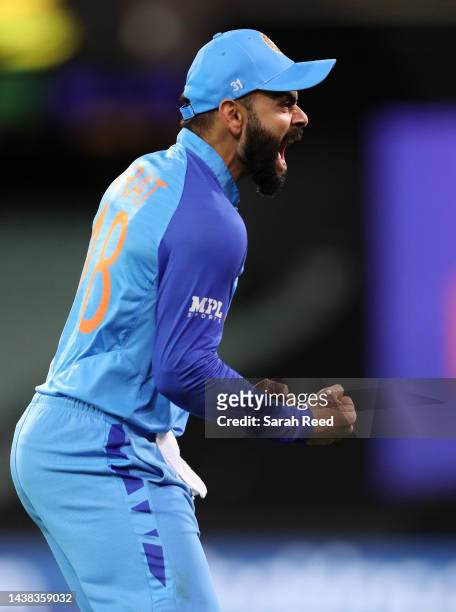 Virat Kohli of India celebrates with the bench the dismissal of Najmul Shanto of Bangladesh for 21 runs during the ICC Men's T20 World Cup match...