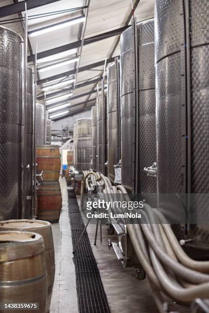 wine, barrel and distillery with vat for production of liquor in factory, warehouse or farm. alcohol, whiskey or beer in industry for manufacturing alcohol in tank for farming, agriculture or winery - vat stock pictures, royalty-free photos & images