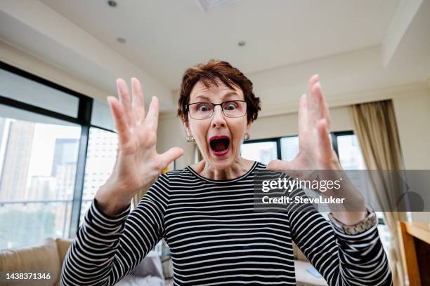 surprised woman indoors. - beneficiary stockfoto's en -beelden