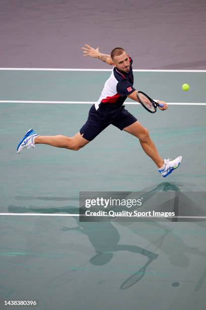 Daniel Evans of Great Britain returns a ball against Stefanos Tsitsipas of Greece in the second round during Day Three of the Rolex Paris Masters...