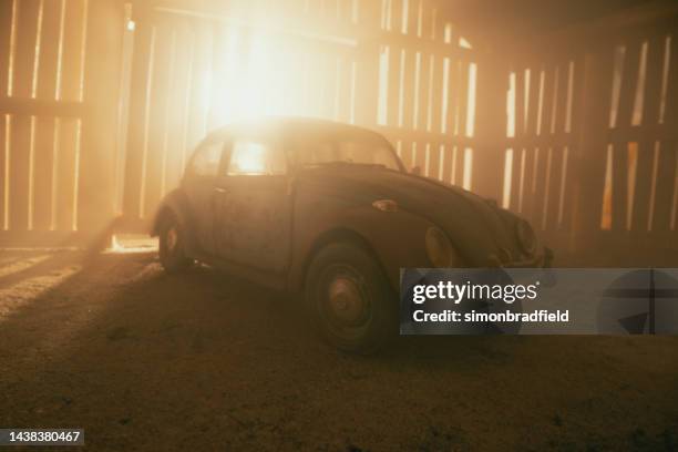 abandoned classic car in a barn - vw beetle stock pictures, royalty-free photos & images