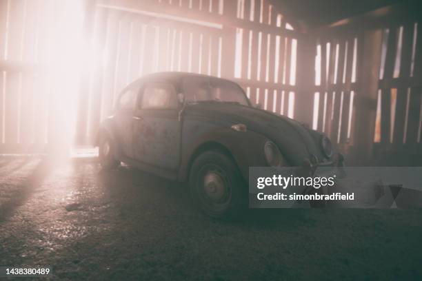 abandoned classic car in a barn - volkswagen stockfoto's en -beelden